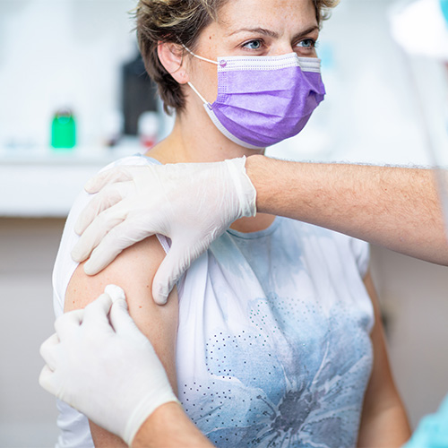 Woman receiving a flu shot.